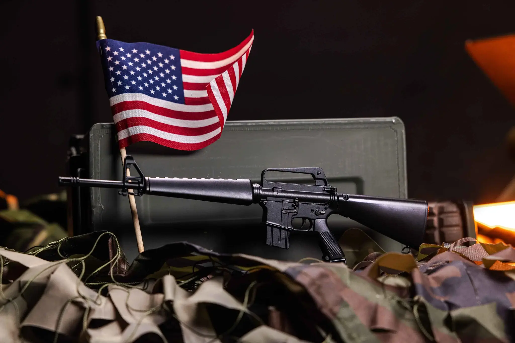goat guns m16a1 next to an American flag product image